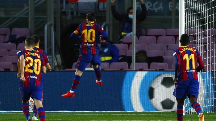 Barcelonas Lionel Messi celebrates after scoring his sides third goal from the penalty spot during the Spanish La Liga soccer match between FC Barcelona and Betis at the Camp Nou stadium in Barcelona, Spain, Saturday, Nov. 7, 2020. (AP Photo/Joan Monfort)