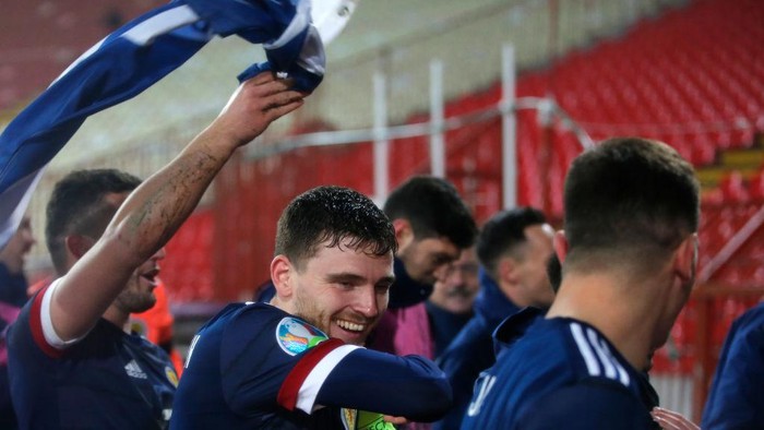BELGRADE, SERBIA - NOVEMBER 12: Andy Robertson of Scotland celebrates with his team after his teams victory in the UEFA EURO 2020 Play-Off Final between Serbia and Scotland at Rajko Mitic Stadium on November 12, 2020 in Belgrade, Serbia. Football Stadiums around Europe remain empty due to the Coronavirus Pandemic as Government social distancing laws prohibit fans inside venues resulting in fixtures being played behind closed doors. (Photo by Srdjan Stevanovic/Getty Images)