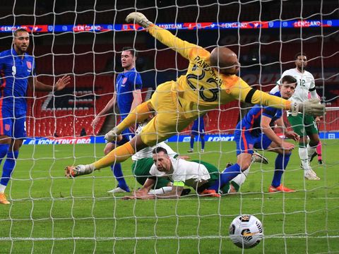 LONDON, ENGLAND - NOVEMBER 12: Harry Maguire of England  scores his team's first goal  during the international friendly match between England and the Republic of Ireland at Wembley Stadium on November 12, 2020 in London, England. Sporting stadiums around the UK remain under strict restrictions due to the Coronavirus Pandemic as Government social distancing laws prohibit fans inside venues resulting in games being played behind closed doors. (Photo by Nick Potts -