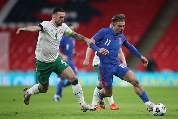 LONDON, ENGLAND - NOVEMBER 12: Jack Grealish of England looks to break past Shane Duffy of Republic of Ireland  during the international friendly match between England and the Republic of Ireland at Wembley Stadium on November 12, 2020 in London, England. Sporting stadiums around the UK remain under strict restrictions due to the Coronavirus Pandemic as Government social distancing laws prohibit fans inside venues resulting in games being played behind closed doors. (Photo by Nick Potts -