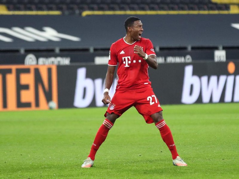 DORTMUND, GERMANY - NOVEMBER 07: David Alaba of Muenchen celebrates his team's first goal  during the Bundesliga match between Borussia Dortmund and FC Bayern Muenchen at Signal Iduna Park on November 07, 2020 in Dortmund, Germany. Sporting stadiums around Germany remain under strict restrictions due to the Coronavirus Pandemic as Government social distancing laws prohibit fans inside venues resulting in games being played behind closed doors. (Photo by Friedemann Vogel - Pool/Getty Images)