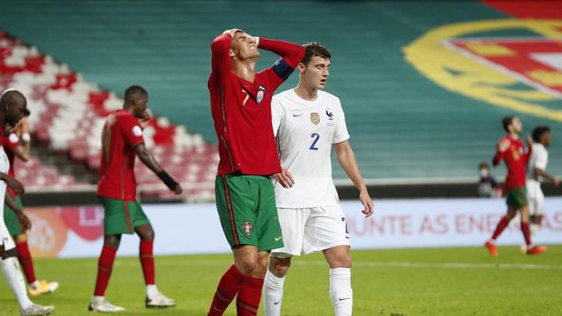 Portugal's Cristiano Ronaldo reacts during the UEFA Nations League soccer match between Portugal and France at the Luz stadium in Lisbon, Saturday, Nov. 14, 2020. (AP Photo/Armando Franca)