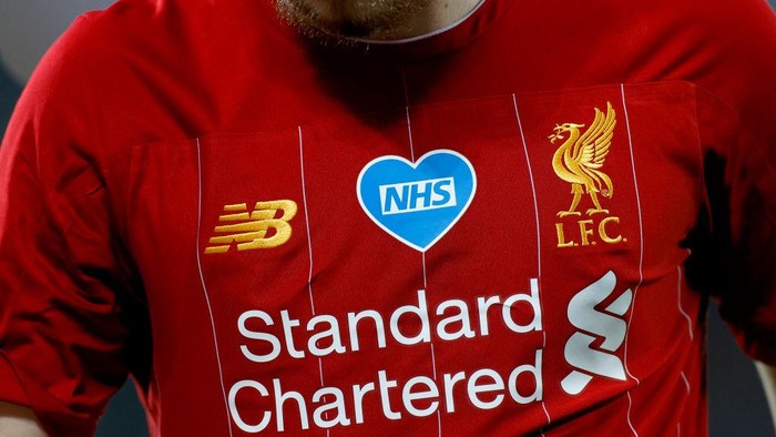 LIVERPOOL, ENGLAND - JUNE 24: Harvey Elliott of Liverpool looks on while the NHS logo is seen on his shirt during the Premier League match between Liverpool FC and Crystal Palace at Anfield on June 24, 2020 in Liverpool, England. (Phil Noble/Pool via Getty Images)
