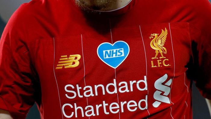 Liverpool LIVERPOOL, ENGLAND - JUNE 24: Harvey Elliott of Liverpool looks on while the NHS logo is seen on his shirt during the Premier League match between Liverpool FC and Crystal Palace at Anfield on June 24, 2020 in Liverpool, England. (Phil Noble/Pool via Getty Images)