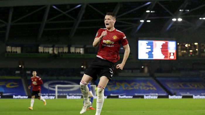 BRIGHTON, ENGLAND - SEPTEMBER 30: Scott McTominay of Manchester United celebrates after scoring his sides first goal during the Carabao Cup fourth round match between Brighton and Hove Albion and Manchester United at Amex Stadium on September 30, 2020 in Brighton, England. Football Stadiums around United Kingdom remain empty due to the Coronavirus Pandemic as Government social distancing laws prohibit fans inside venues resulting in fixtures being played behind closed doors. (Photo by Matt Dunham - Pool/Getty Images)
