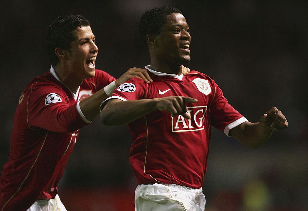 MANCHESTER, UNITED KINGDOM - APRIL 10: Patrice Evra of Manchester United celebrates scoring his team's seventh goal with team mate Cristiano Ronaldo during the UEFA Champions League Quarter Final, second leg match between Manchester United and AS Roma at Old Trafford on April 10, 2007 in Manchester, England. (Photo by Alex Livesey/Getty Images)