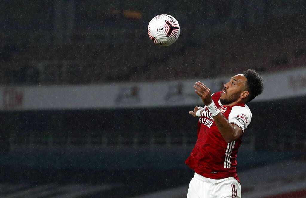 Arsenal's Pierre-Emerick Aubameyang heads the ball during the English Premier League soccer match between Arsenal and Aston Villa at the Emirates stadium in London, Sunday, Nov. 8, 2020. (AP Photo/Alastair Grant, Pool)