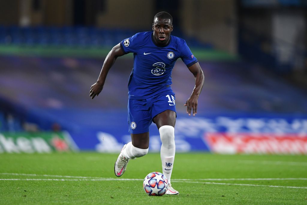 LONDON, ENGLAND - OCTOBER 20: Kurt Zouma of Chelsea runs with the ball during the UEFA Champions League Group E stage match between Chelsea FC and FC Sevilla at Stamford Bridge on October 20, 2020 in London, England. Sporting stadiums around the UK remain under strict restrictions due to the Coronavirus Pandemic as Government social distancing laws prohibit fans inside venues resulting in games being played behind closed doors. (Photo by Mike Hewitt/Getty Images)