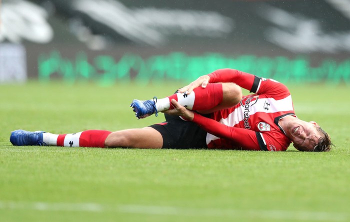 SOUTHAMPTON, ENGLAND - OCTOBER 25: Jannick Vestergaard of Southampton goes down injured during the Premier League match between Southampton and Everton at St Marys Stadium on October 25, 2020 in Southampton, England. Sporting stadiums around the UK remain under strict restrictions due to the Coronavirus Pandemic as Government social distancing laws prohibit fans inside venues resulting in games being played behind closed doors. (Photo by Naomi Baker/Getty Images)