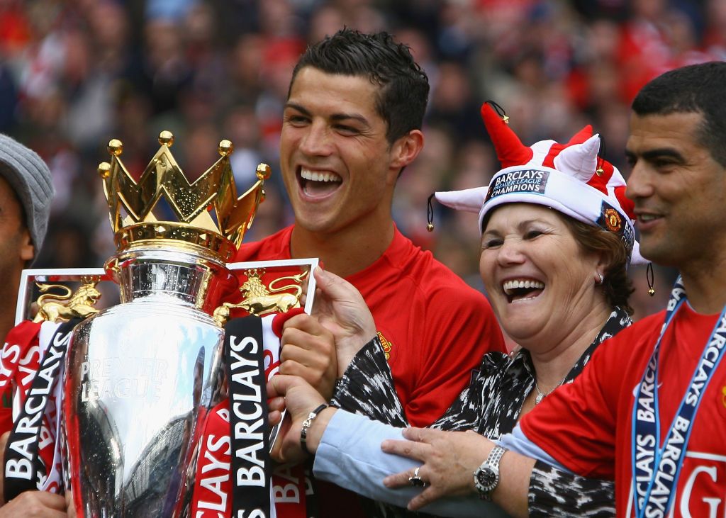 MANCHESTER, ENGLAND - MAY 16:  Cristiano Ronaldo of Manchester United celebrates winning the Barclays Premier League trophy with his mother, Dolores Aveiro after the Barclays Premier League match between Manchester United and Arsenal at Old Trafford on May 16, 2009 in Manchester, England.  (Photo by Alex Livesey/Getty Images)