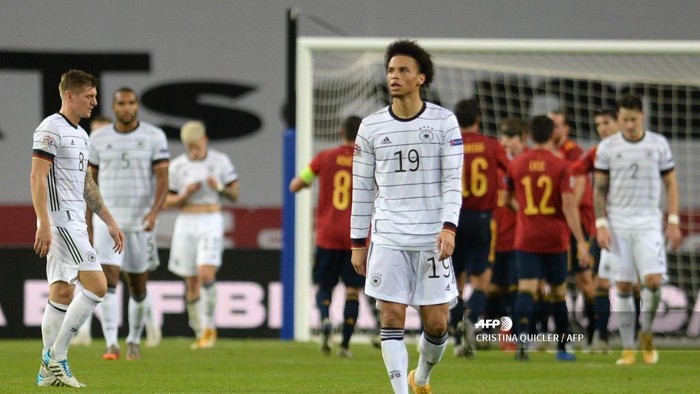 Germanys midfielder Leroy Sane reacts to Spains fourth goal scored by Spains midfielder Ferran Torres during the UEFA Nations League footbal match between Spain and Germany at La Cartuja stadium in Seville on November 17, 2020. (Photo by CRISTINA QUICLER / AFP)