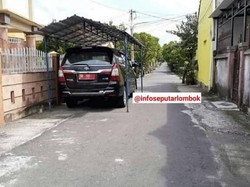 Viral Mobil Pelat Merah Parkir di Jalan Umum Pakai Tenda Pula, Begini Ceritanya