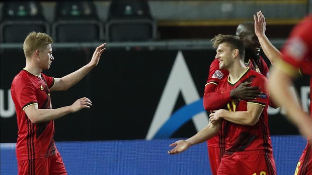 Belgium's Kevin De Bruyne, left, celebrates after scoring his side's fourth goal during the UEFA Nations League soccer match between Belgium and Denmark at the King Power stadium in Leuven, Belgium, Wednesday, Nov. 18, 2020. (AP Photo/Francisco Seco)