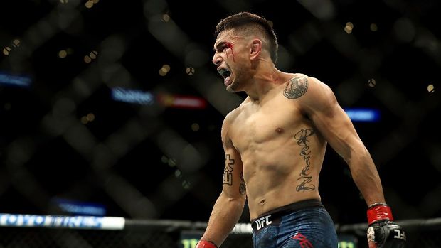 LOS ANGELES, CA - AUGUST 04: Alex Perez celebrates his win over Jose Torres in one round of the featherweight bout during UFC 227 at Staples Center on August 4, 2018 in Los Angeles, United States.   Joe Scarnici/Getty Images/AFP