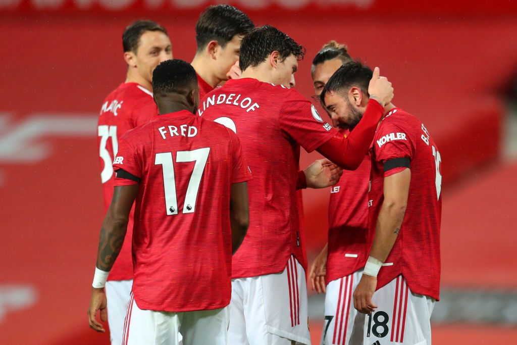 MANCHESTER, ENGLAND - NOVEMBER 21: Bruno Fernandes of Manchester United celebrates with teammate Victor Lindelof after scoring his team's first goal during the Premier League match between Manchester United and West Bromwich Albion at Old Trafford on November 21, 2020 in Manchester, England. Sporting stadiums around the UK remain under strict restrictions due to the Coronavirus Pandemic as Government social distancing laws prohibit fans inside venues resulting in games being played behind closed doors. (Photo by Catherine Ivill/Getty Images)