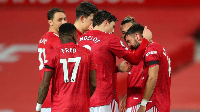 Manchester United MANCHESTER, ENGLAND - NOVEMBER 21: Bruno Fernandes of Manchester United celebrates with teammate Victor Lindelof after scoring his teams first goal during the Premier League match between Manchester United and West Bromwich Albion at Old Trafford on November 21, 2020 in Manchester, England. Sporting stadiums around the UK remain under strict restrictions due to the Coronavirus Pandemic as Government social distancing laws prohibit fans inside venues resulting in games being played behind closed doors. (Photo by Catherine Ivill/Getty Images)