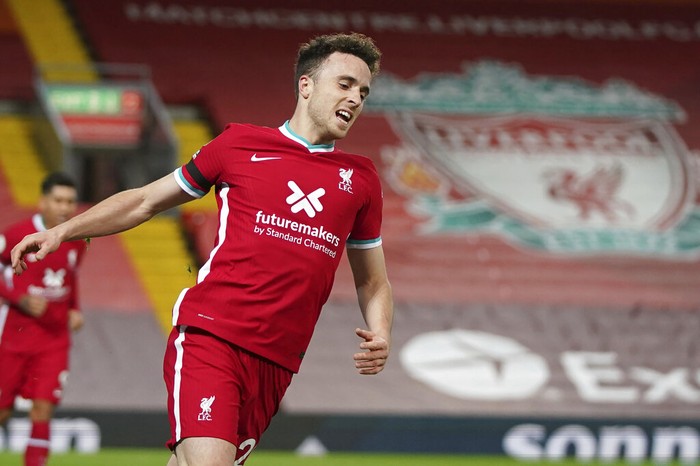 Liverpools Diogo Jota celebrates after scoring his sides second goal during the English Premier League soccer match between Liverpool and Leicester City at Anfield stadium in Liverpool, England, Sunday, Nov. 22, 2020. (AP Photo/Jon Super)