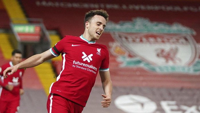 Liverpools Diogo Jota celebrates after scoring his sides second goal during the English Premier League soccer match between Liverpool and Leicester City at Anfield stadium in Liverpool, England, Sunday, Nov. 22, 2020. (AP Photo/Jon Super)