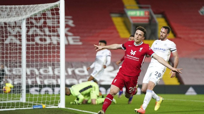 Liverpools Diogo Jota, center, celebrates after scoring his sides second goal during the English Premier League soccer match between Liverpool and Leicester City at Anfield stadium in Liverpool, England, Sunday, Nov. 22, 2020. (AP Photo/Jon Super)