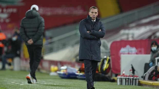Leicester's manager Brendan Rodgers, right, and Liverpool's manager Jurgen Klopp walk during the English Premier League soccer match between Liverpool and Leicester City at Anfield stadium in Liverpool, England, Sunday, Nov. 22, 2020. (AP Photo/Jon Super)