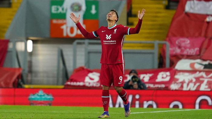 Roberto Firmino Liverpool LIVERPOOL, ENGLAND - NOVEMBER 22: Roberto Firmino of Liverpool celebrates after scoring their teams third goal during the Premier League match between Liverpool and Leicester City at Anfield on November 22, 2020 in Liverpool, England. Sporting stadiums around the UK remain under strict restrictions due to the Coronavirus Pandemic as Government social distancing laws prohibit fans inside venues resulting in games being played behind closed doors. (Photo by Jon Super - Pool/Getty Images)