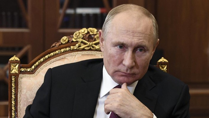 Russian President Vladimir Putin listens during a meeting in the Kremlin, in Moscow, Russia, Thursday, Nov. 19, 2020. (Alexei Nikolsky, Sputnik, Kremlin Pool Photo via AP)