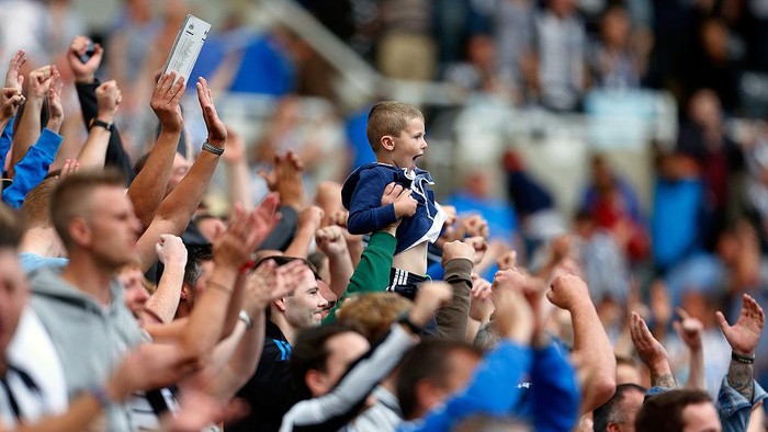 NEWCASTLE, ENGLAND - AUGUST 31: Newcastle fans celebrate at full time of the Premier League match between Newcastle United and Fulham at the St James Park on August 31, 2013 in Newcastle-Upon-Tyne, England. (Photo by Paul Thomas/Getty Images)