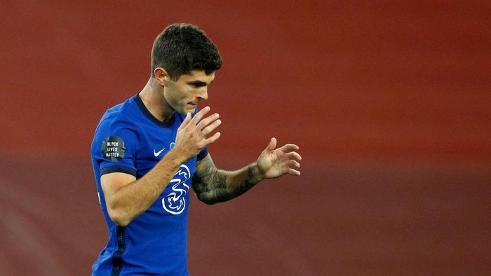 Christian Pulisic LIVERPOOL, ENGLAND - JULY 22: Christian Pulisic of Chelsea reacts during the Premier League match between Liverpool FC and Chelsea FC at Anfield on July 22, 2020 in Liverpool, England. Football Stadiums around Europe remain empty due to the Coronavirus Pandemic as Government social distancing laws prohibit fans inside venues resulting in all fixtures being played behind closed doors. (Photo by Phil Noble/Pool via Getty Images)