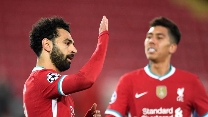 Mohamed Salah LIVERPOOL, ENGLAND - OCTOBER 27: Mohamed Salah of Liverpool celebrates after he scores his teams second goal from the penalty spot during the UEFA Champions League Group D stage match between Liverpool FC and FC Midtjylland at Anfield on October 27, 2020 in Liverpool, England. Sporting stadiums around the UK remain under strict restrictions due to the Coronavirus Pandemic as Government social distancing laws prohibit fans inside venues resulting in games being played behind closed doors. (Photo by Peter Powell -