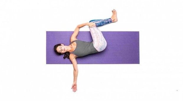 Two knee spinal twist pose pada yoga