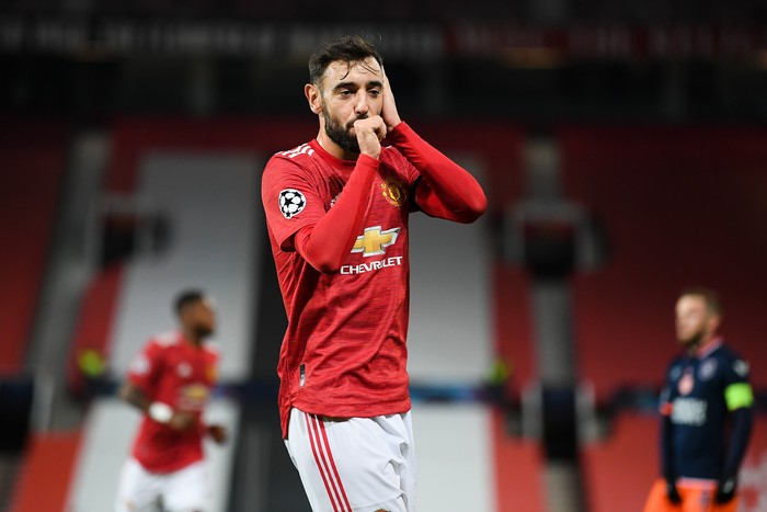 MANCHESTER, ENGLAND - NOVEMBER 24: Bruno Fernandes of Manchester United celebrates after scoring their sides second goal during the UEFA Champions League Group H stage match between Manchester United and İstanbul Basaksehir at Old Trafford on November 24, 2020 in Manchester, England. Sporting stadiums around the UK remain under strict restrictions due to the Coronavirus Pandemic as Government social distancing laws prohibit fans inside venues resulting in games being played behind closed doors. (Photo by Michael Regan/Getty Images)
