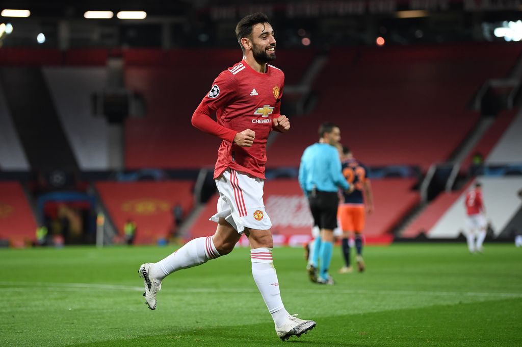 MANCHESTER, ENGLAND - NOVEMBER 24: Bruno Fernandes of Manchester United celebrates after scoring their sides second goal during the UEFA Champions League Group H stage match between Manchester United and İstanbul Basaksehir at Old Trafford on November 24, 2020 in Manchester, England. Sporting stadiums around the UK remain under strict restrictions due to the Coronavirus Pandemic as Government social distancing laws prohibit fans inside venues resulting in games being played behind closed doors. (Photo by Michael Regan/Getty Images)