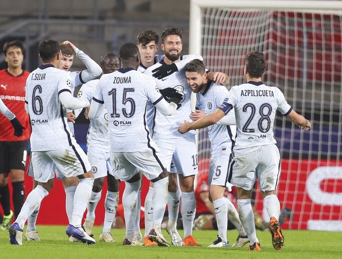 Chelseas Olivier Giroud, center, celebrates with his teammates after scoring his sides second goal during the Champions League, group E soccer match between Rennes and Chelsea at the Roazhon Park stadium in Rennes, France, Tuesday, Nov. 24, 2020. Chelsea won 2-1. (AP Photo/David Vincent)