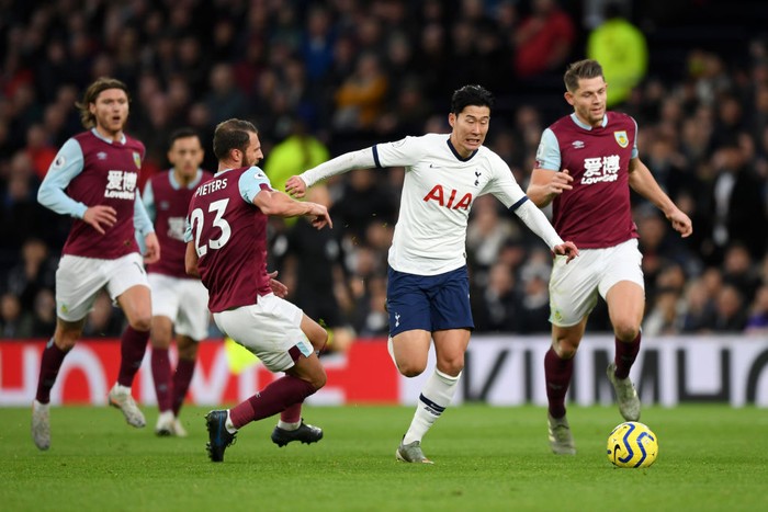 LONDON, ENGLAND - DECEMBER 07: Heung-Min Son of Tottenham Hotspur breaks past Erik Pieters of Burnley to go on and score his teams third goal during the Premier League match between Tottenham Hotspur and Burnley FC at Tottenham Hotspur Stadium on December 07, 2019 in London, United Kingdom. (Photo by Shaun Botterill/Getty Images)