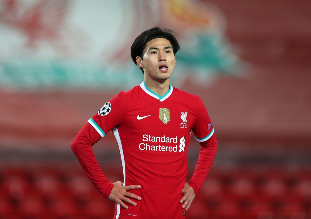 LIVERPOOL, ENGLAND - OCTOBER 27: Takumi Minamino of Liverpool looks on during the UEFA Champions League Group D stage match between Liverpool FC and FC Midtjylland at Anfield on October 27, 2020 in Liverpool, England. Sporting stadiums around the UK remain under strict restrictions due to the Coronavirus Pandemic as Government social distancing laws prohibit fans inside venues resulting in games being played behind closed doors. (Photo by Peter Byrne -  Pool/Getty Images)