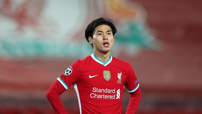LIVERPOOL, ENGLAND - OCTOBER 27: Takumi Minamino of Liverpool looks on during the UEFA Champions League Group D stage match between Liverpool FC and FC Midtjylland at Anfield on October 27, 2020 in Liverpool, England. Sporting stadiums around the UK remain under strict restrictions due to the Coronavirus Pandemic as Government social distancing laws prohibit fans inside venues resulting in games being played behind closed doors. (Photo by Peter Byrne -  Pool/Getty Images)