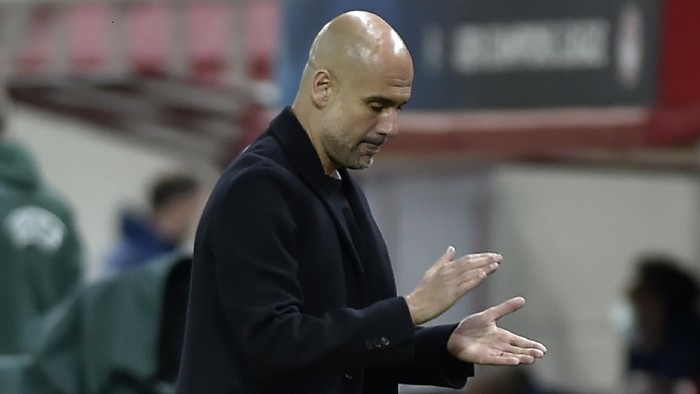 PIRAEUS, GREECE - NOVEMBER 25: Pep Guardiola, Manager of Manchester City  reacts during the UEFA Champions League Group C stage match between Olympiacos FC and Manchester City at Karaiskakis Stadium on November 25, 2020 in Piraeus, Greece. Football Stadiums around Europe remain empty due to the Coronavirus Pandemic as Government social distancing laws prohibit fans inside venues resulting in fixtures being played behind closed doors. (Photo by Milos Bicanski/Getty Images)
