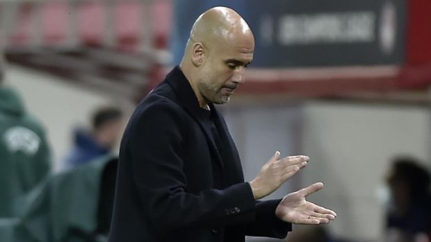 PIRAEUS, GREECE - NOVEMBER 25: Pep Guardiola, Manager of Manchester City  reacts during the UEFA Champions League Group C stage match between Olympiacos FC and Manchester City at Karaiskakis Stadium on November 25, 2020 in Piraeus, Greece. Football Stadiums around Europe remain empty due to the Coronavirus Pandemic as Government social distancing laws prohibit fans inside venues resulting in fixtures being played behind closed doors. (Photo by Milos Bicanski/Getty Images)