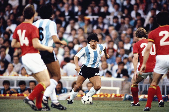 BARCELONA, SPAIN - JUNE 13: Argentina player Diego Maradona (c) takes on the Belguim defence during the 1982 FIFA World Cup match between Argentina and Belguim at the Nou Camp stadium on June 13, 1982 in Barcelona, Spain.  (Photo by Steve Powell/Allsport/Getty Images)