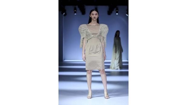 A model walks the runway of Jakarta Fashion Week x Mandiri Private Present Tribute to Barli Asmara show during Jakarta Fashion Week 2021 in Senayan City, Jakarta.