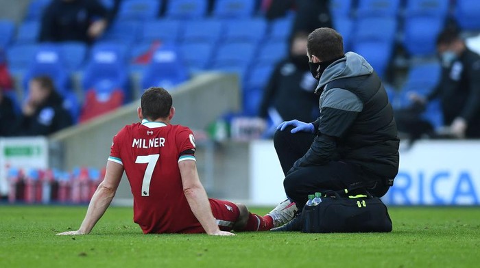 BRIGHTON, ENGLAND - NOVEMBER 28: James Milner of Liverpool receives medical treatment during the Premier League match between Brighton & Hove Albion and Liverpool at American Express Community Stadium on November 28, 2020 in Brighton, England. Sporting stadiums around the UK remain under strict restrictions due to the Coronavirus Pandemic as Government social distancing laws prohibit fans inside venues resulting in games being played behind closed doors. (Photo by Neil Hall - Pool/Getty Images)