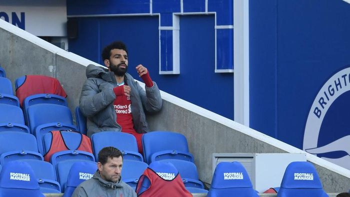 Mohamed Salah BRIGHTON, ENGLAND - NOVEMBER 28: Mohamed Salah of Liverpool reacts on the bench during the Premier League match between Brighton & Hove Albion and Liverpool at American Express Community Stadium on November 28, 2020 in Brighton, England. Sporting stadiums around the UK remain under strict restrictions due to the Coronavirus Pandemic as Government social distancing laws prohibit fans inside venues resulting in games being played behind closed doors. (Photo by Mike Hewitt/Getty Images)