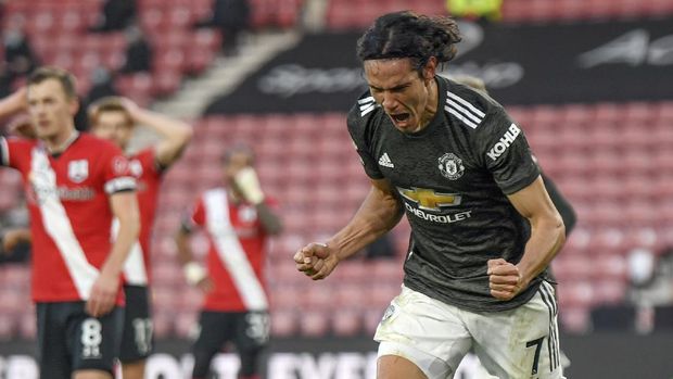 Manchester United's Edinson Cavani celebrates after scoring his side's second goal during an English Premier League soccer match between Southampton and Manchester United at the St. Mary's stadium in Southampton, England, Sunday, Nov. 29, 2020. (Mike Hewitt, Pool via AP)
