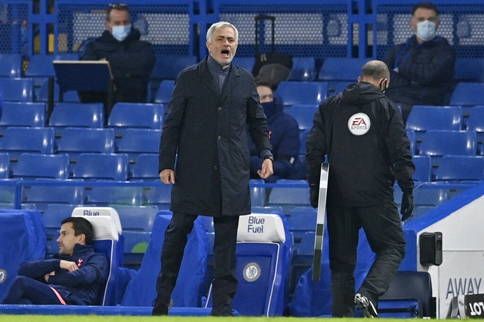 Tottenhams manager Jose Mourinho stands by the touchline during the English Premier League soccer match between Chelsea and Tottenham Hotspur at Stamford Bridge in London, England, Sunday, Nov. 29, 2020. (Justin Tallis/Pool via AP)