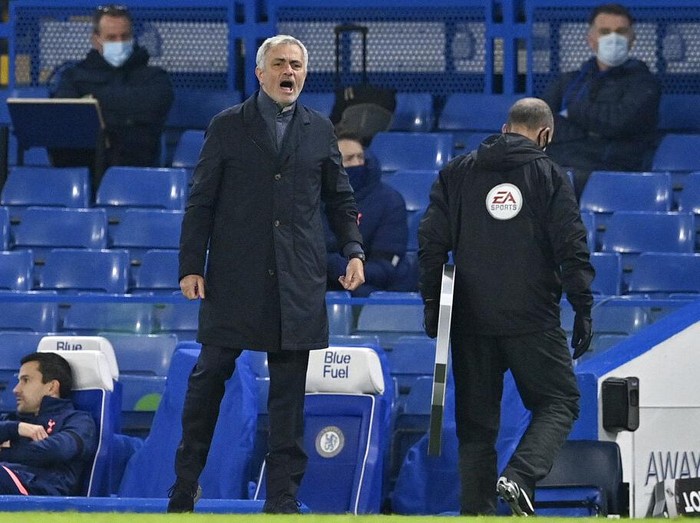 Tottenham's manager Jose Mourinho stands by the touchline during the English Premier League soccer match between Chelsea and Tottenham Hotspur at Stamford Bridge in London, England, Sunday, Nov. 29, 2020. (Justin Tallis/Pool via AP)
