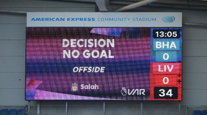 Liverpool VAR BRIGHTON, ENGLAND - NOVEMBER 28: The big screen shows the VAR decision to disallow Liverpool's first goal during the Premier League match between Brighton & Hove Albion and Liverpool at American Express Community Stadium on November 28, 2020 in Brighton, England. Sporting stadiums around the UK remain under strict restrictions due to the Coronavirus Pandemic as Government social distancing laws prohibit fans inside venues resulting in games being played behind closed doors. (Photo by Mike Hewitt/Getty Images)