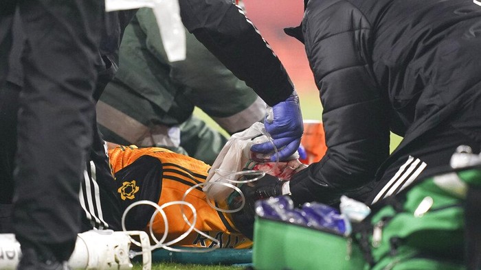 Wolverhampton Wanderers Raul Jimenez receives treatment from medical staff following a head clash with Arsenals David Luiz during the English Premier League soccer match between Arsenal and Wolverhampton Wanderers at Emirates Stadium, London, Sunday, Nov. 29, 2020. (John Walton/Pool via AP)
