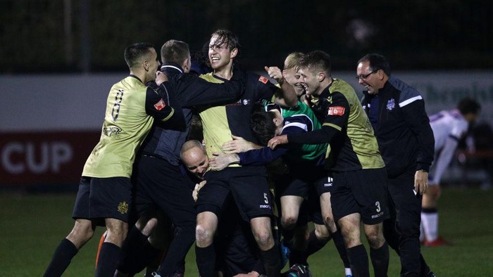 CROSBY, ENGLAND - NOVEMBER 29: Marine players celebrate winning the match after the final whistle during the Emirates FA Cup Second Round match between Marine FC and Havant and Waterloovile at The Marine Travel Arena on November 29, 2020 in Crosby, England. Sporting stadiums around the UK remain under strict restrictions due to the Coronavirus Pandemic as Government social distancing laws prohibit fans inside venues resulting in games being played behind closed doors. (Photo by Jan Kruger/Getty Images)