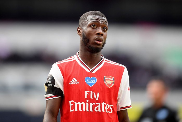 LONDON, ENGLAND - JULY 12: Nicolas Pepe of Arsenal reacts during the Premier League match between Tottenham Hotspur and Arsenal FC at Tottenham Hotspur Stadium on July 12, 2020 in London, England. Football Stadiums around Europe remain empty due to the Coronavirus Pandemic as Government social distancing laws prohibit fans inside venues resulting in all fixtures being played behind closed doors. (Photo by Michael Regan/Getty Images)