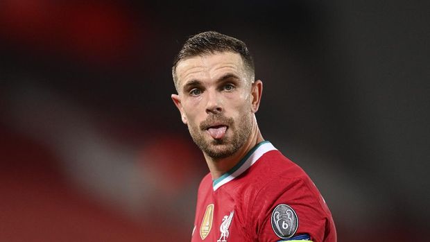 Liverpool's Jordan Henderson reacts during the Champions League group D soccer match between Liverpool and Ajax at Anfield stadium in Liverpool, England, Tuesday, Dec. 1, 2020. (Michael Regan/Pool via AP)